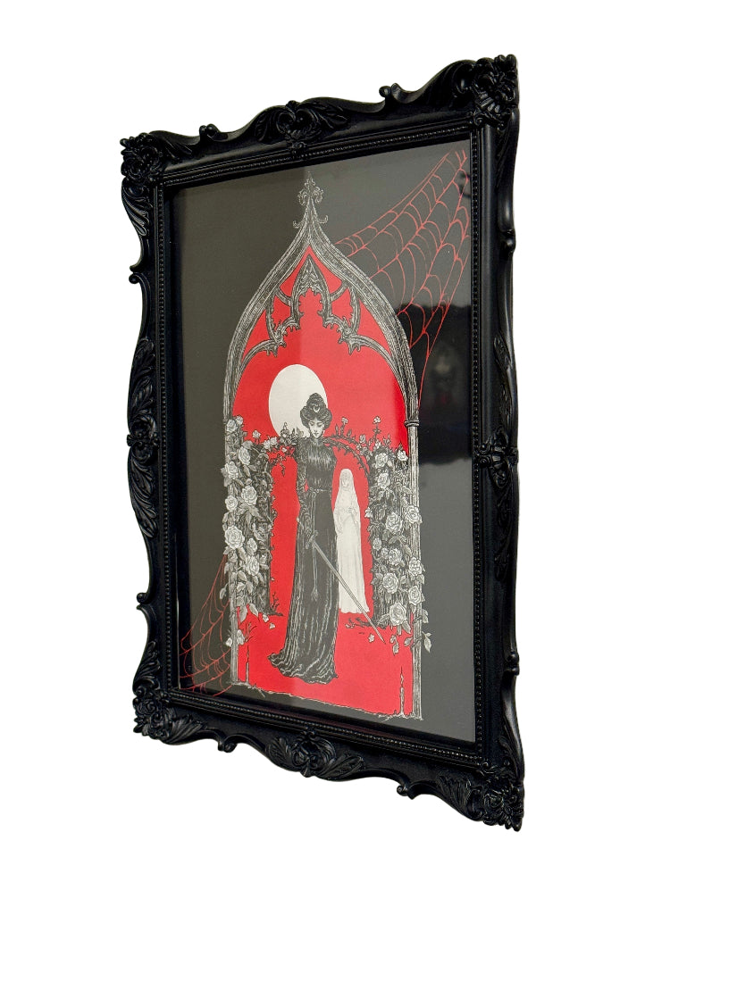 Ink drawing with black frame and artistic design on a white wall