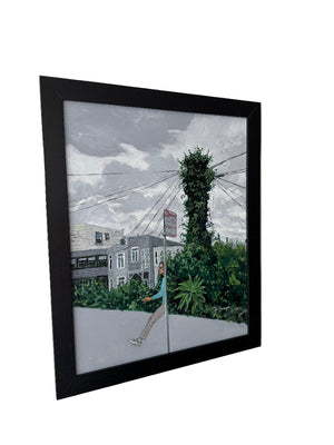 Framed artwork of a street scene with trees and a house on a white background