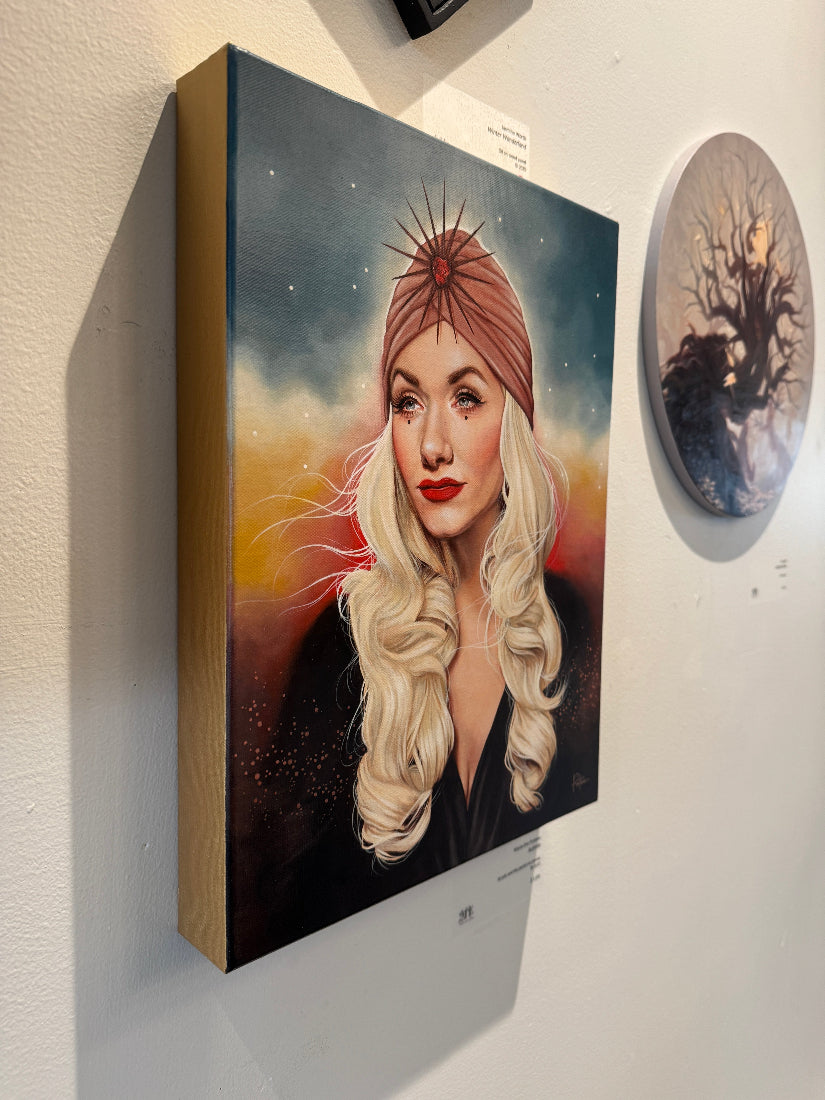 Canvas painting of a woman with a pink headband on a wall