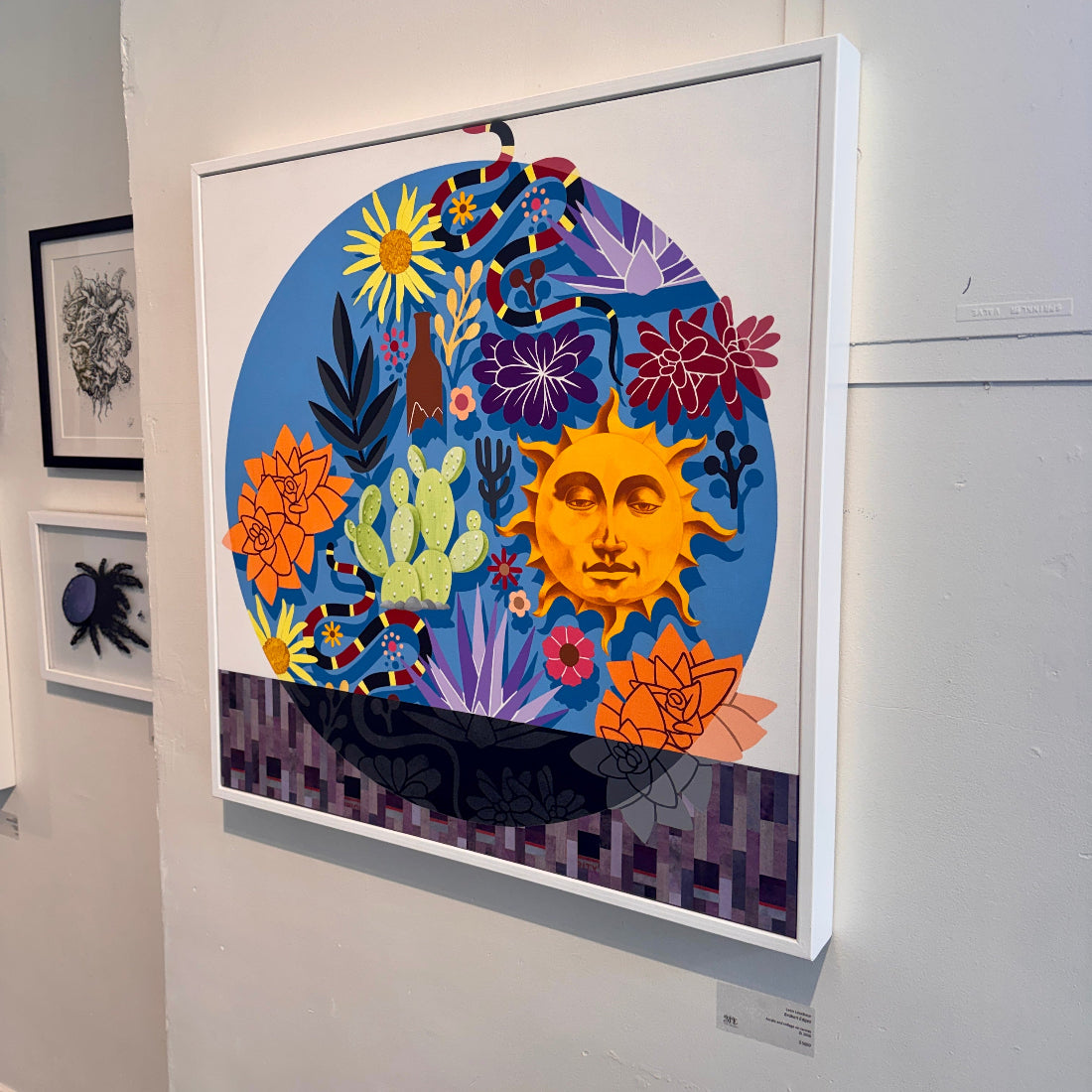 Colorful abstract artwork with sun and plants on a white wall
