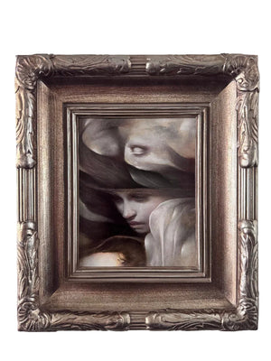 An ornate square framed painting featuring a classical-style portrait of a woman's face with draped shadows and pale flesh tones, set in a detailed metallic silver frame against a light gray wall.