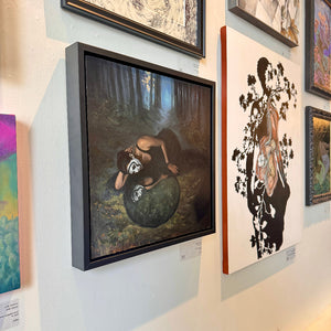 Art gallery wall with various framed artworks