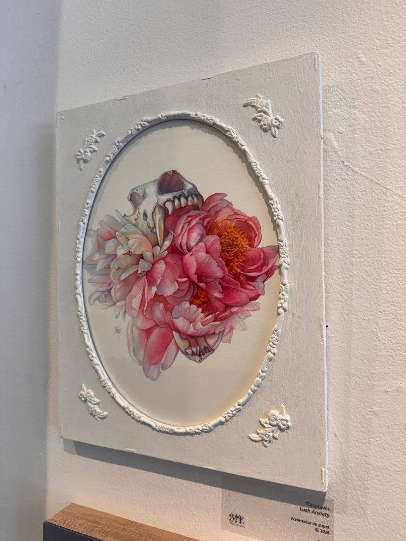 Decorative wall art with a pink flower design on a white background