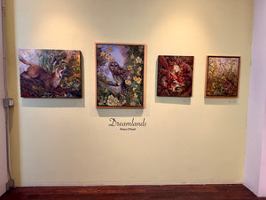 Four framed artworks on a wall with 'Dreamlands' text below.