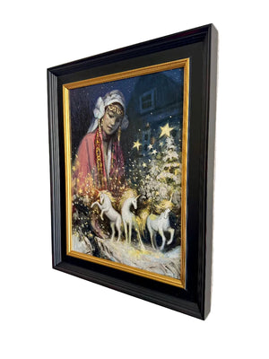 Framed artwork of a woman with unicorns and a Christmas tree on a wall.