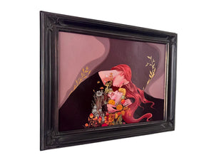 A framed painting featuring a stylized illustration of a woman with long red hair embracing flowers, set in a black ornate frame and hanging on a white wall.