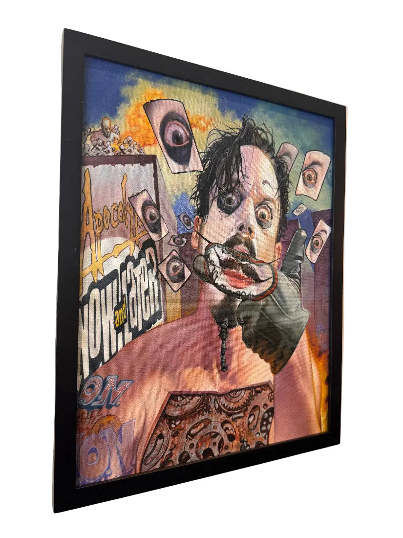 Framed artwork with a stylized portrait and abstract elements on a wall.