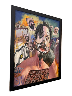 Framed artwork with a stylized portrait and abstract elements on a wall.