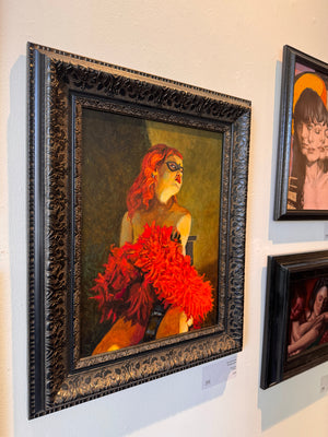 Framed painting of a woman with red hair and flowers on a wall with other artworks.