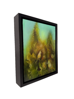 Framed artwork of birds in a natural setting on a white wall