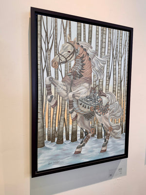 Framed artwork of a horse in a snowy forest scene on a wall.