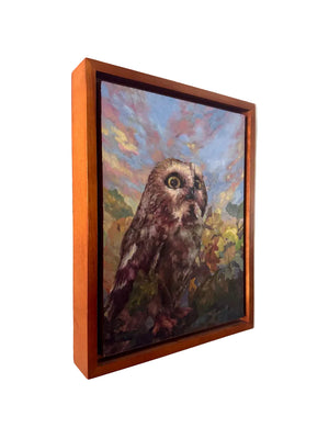 Framed painting of an owl on a wall