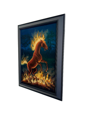 Framed artwork of a horse with flames on a white wall