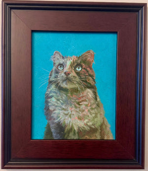 Framed painting of a cat on a beige wall