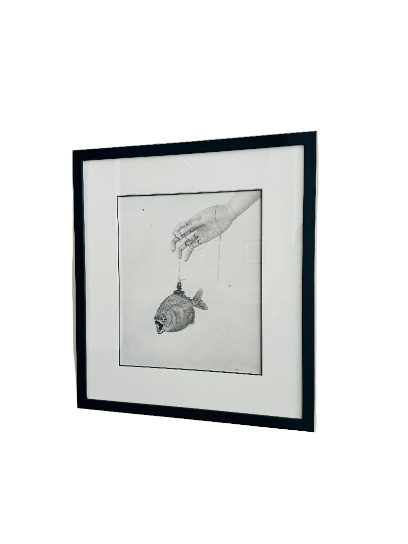 Framed black and white artwork on a white wall
