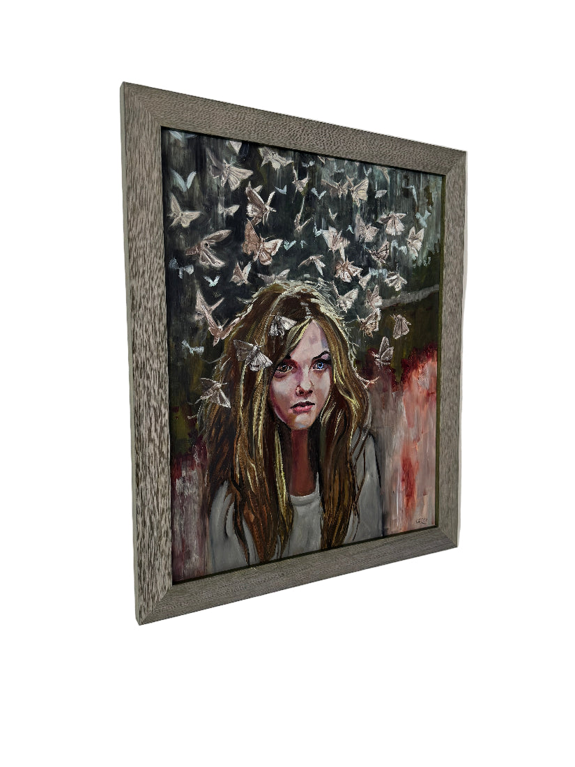 Framed artwork of a woman with long hair on a white background