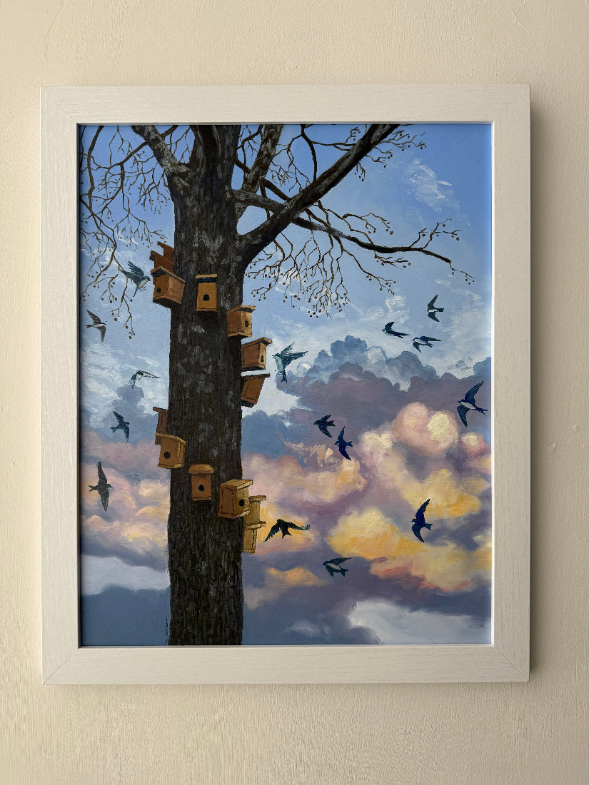 Tree with multiple birdhouses and birds against a colorful sky