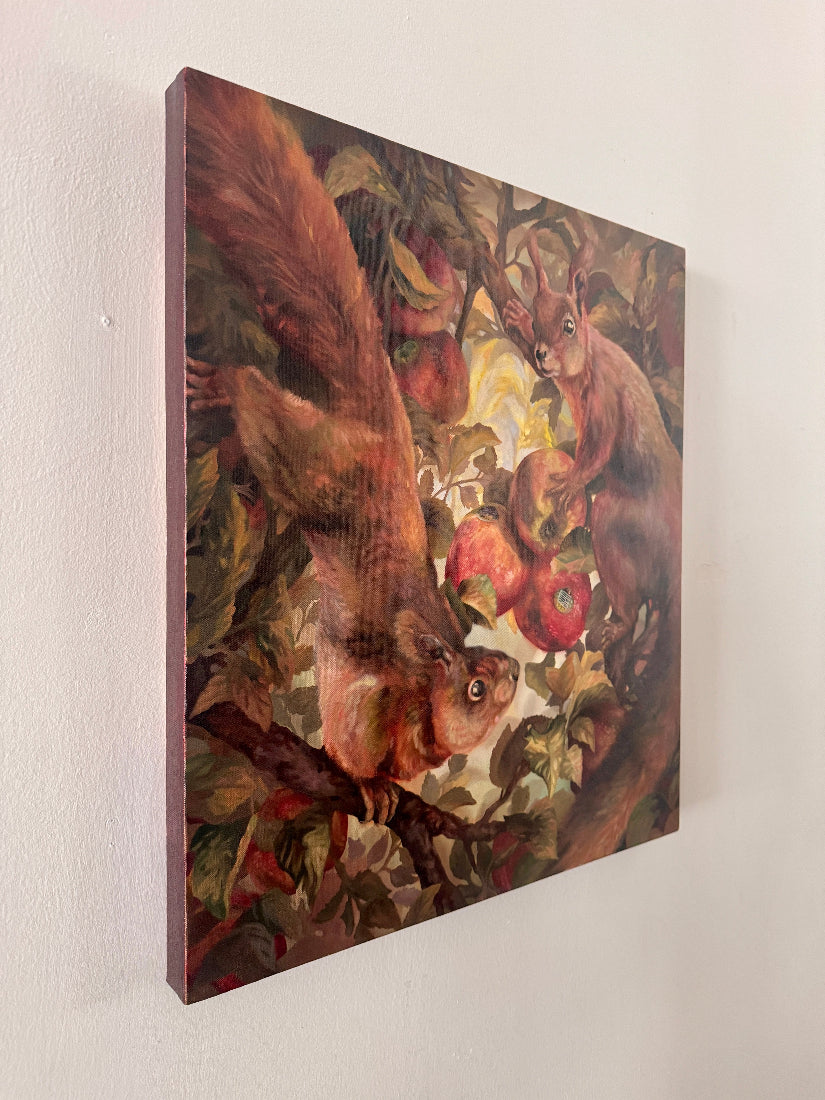 Canvas painting of two squirrels on a branch with apples against a white wall.
