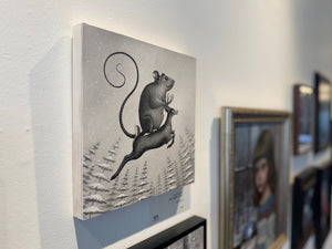Artwork of a rat on a deer in a gallery setting with other artworks.