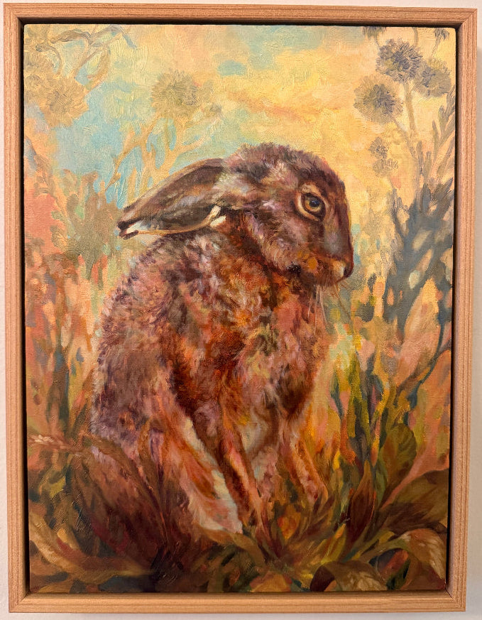 Framed painting of a hare in a natural setting