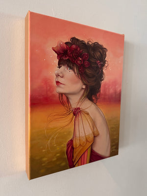 Canvas painting of a woman with flowers in her hair against a warm gradient background