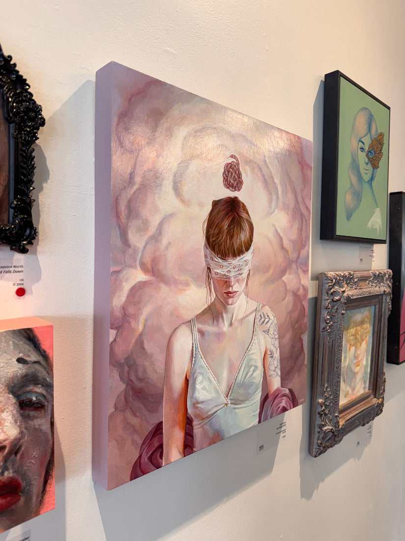Framed artwork on a table with other decorative items