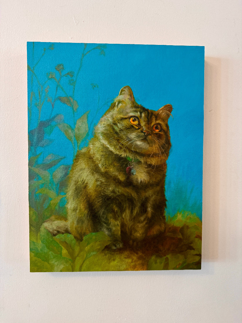 Painting of a cat sitting on grass with a blue background