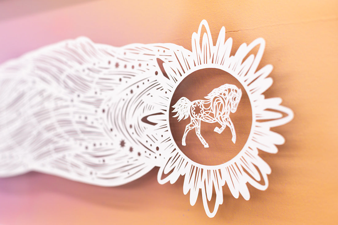 Decorative design with a horse inside a sunflower-like frame on a gradient background