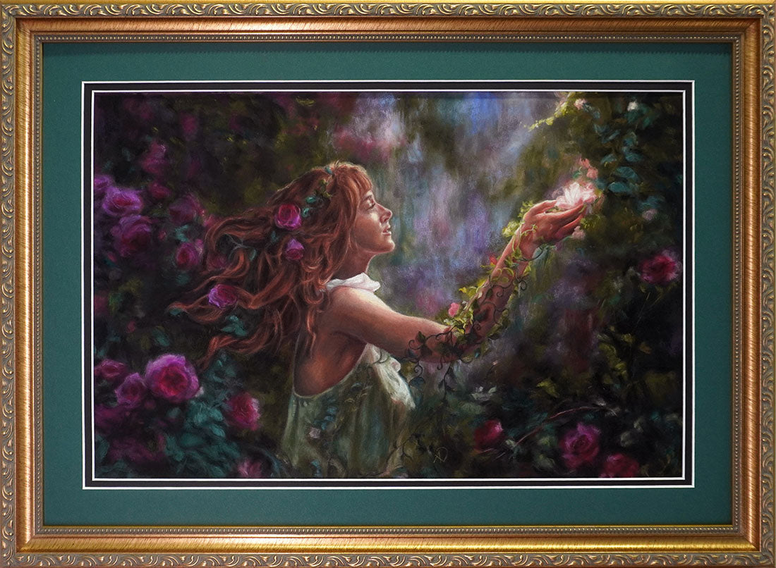 Framed artwork of a woman holding a glowing orb amidst flowers