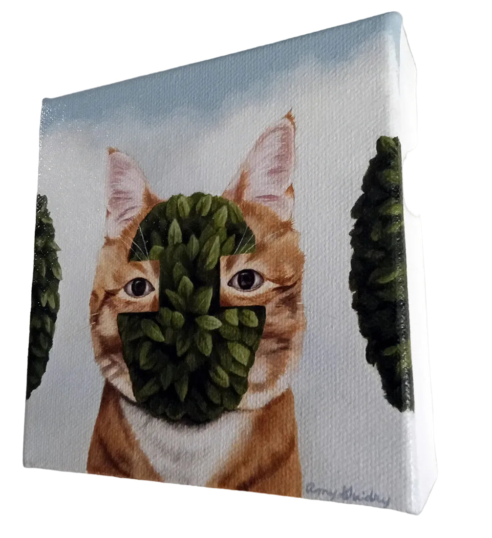Cat with a leafy green mask on a light blue background