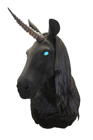 Black unicorn head with a blue eye on a white background