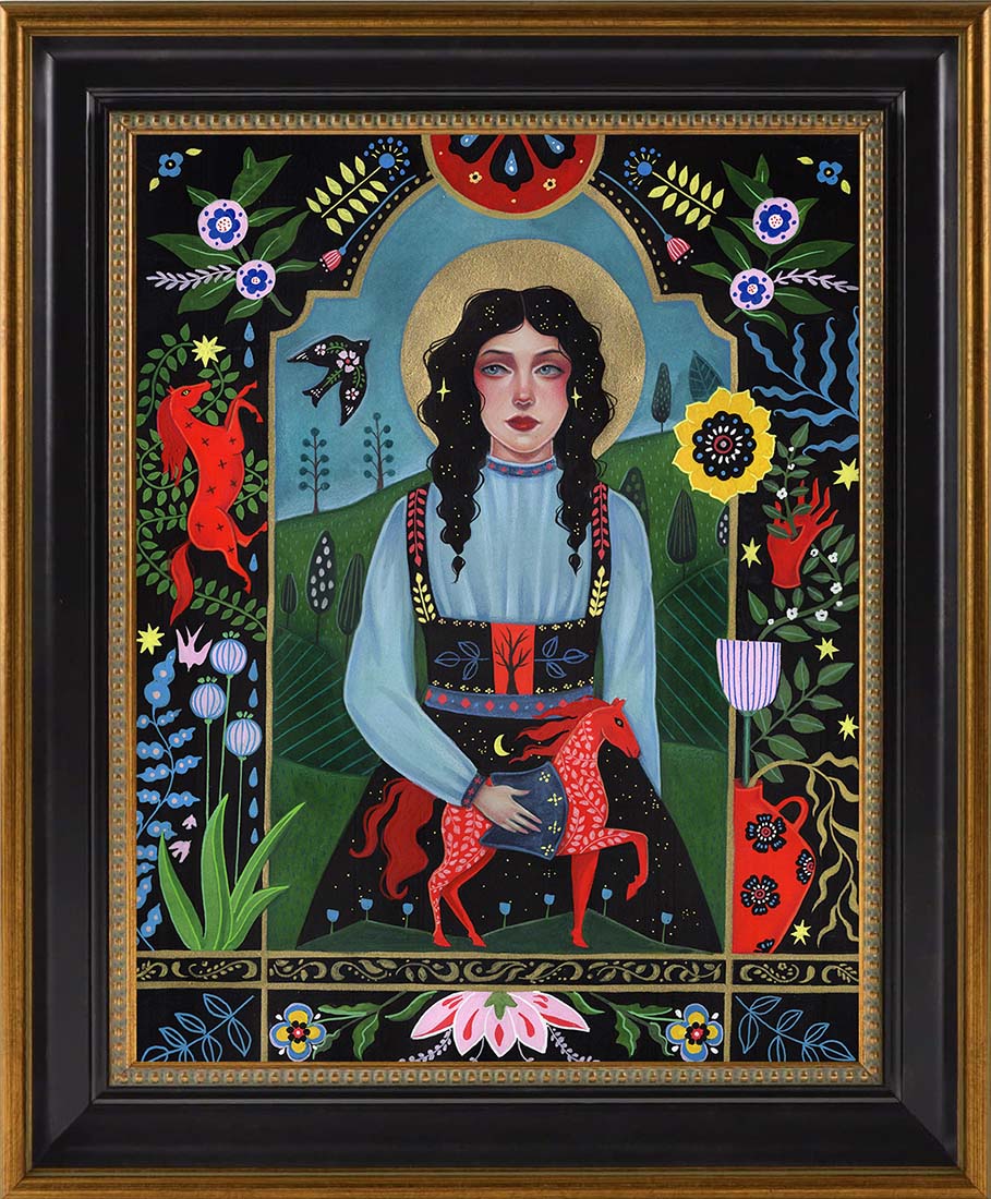 Framed artwork of a woman with a colorful, decorative border featuring animals and plants.
