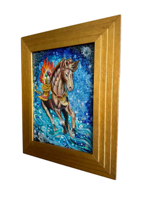 Framed artwork of a horse with a colorful background on a white wall