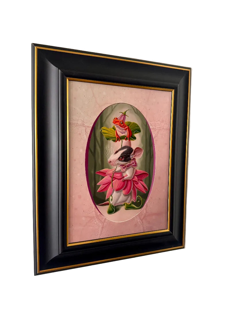 Framed artwork of a mouse and frog on a pink background
