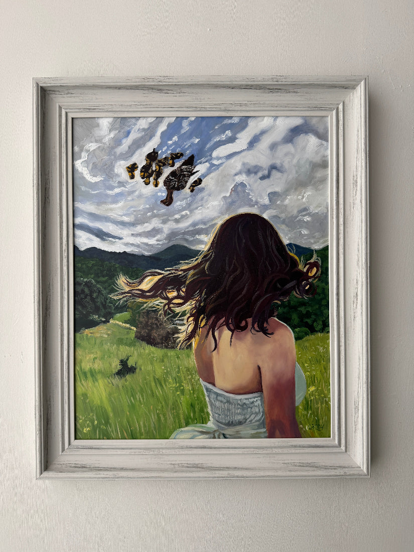 Framed artwork of a woman with ducks and ducklings in a natural setting