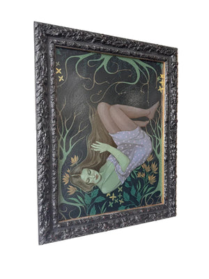 Framed artwork of a woman with long hair and flowers on a dark background