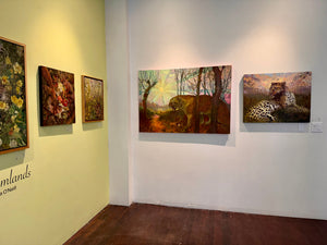Art gallery with various paintings on the walls