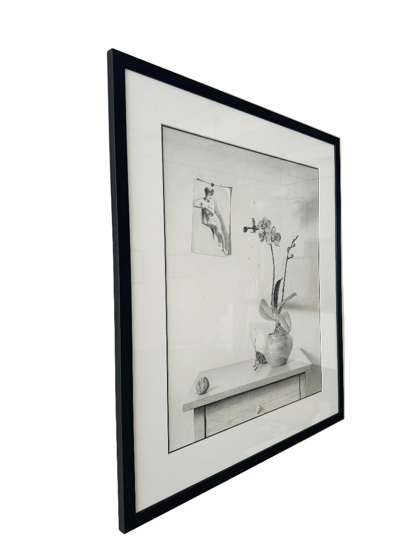 Framed black and white artwork on a wall