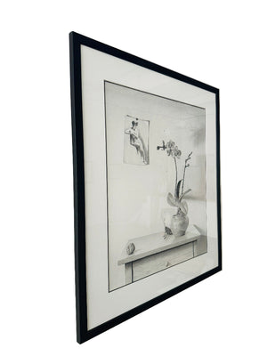 Framed black and white artwork on a wall