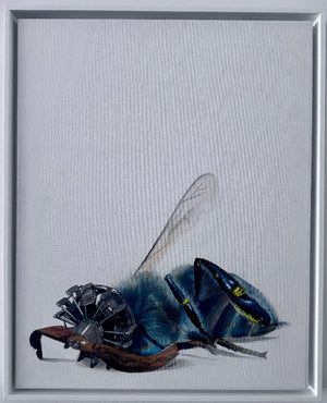 A framed painting featuring a detailed illustration of a blue and black bee with metallic mechanical parts on its body, set against a light gray background.