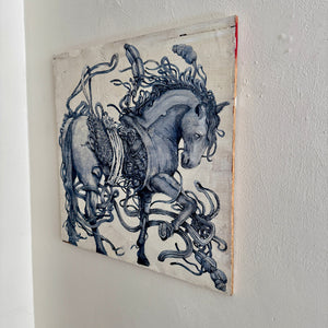 Decorative wall art of a horse with intricate details on a plain wall.
