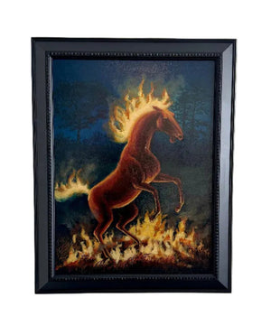 Framed artwork of a horse with flames on a white wall