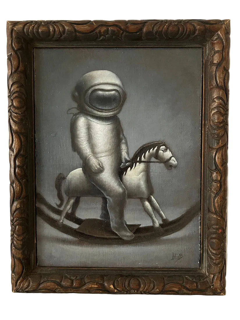 Astronaut riding a toy horse on a gray background