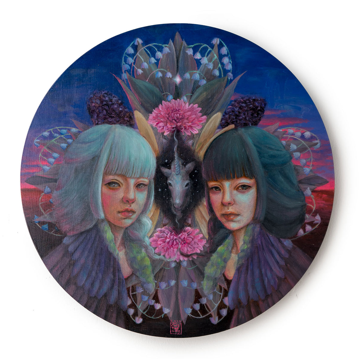 Wall shot of a circular painting of two young women with grey and white hair flanking a unicorn head and flowers in blue and pink sunset hues.