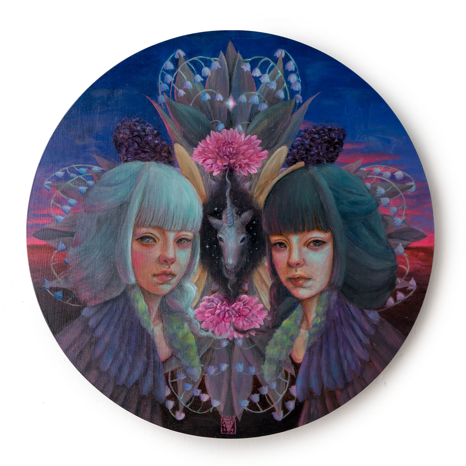 circular painting of two young women with grey and white hair flanking a unicorn head and flowers in blue and pink sunset hues.
