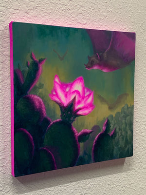 Canvas painting of a bat among cacti with a glowing pink flower on a textured wall.