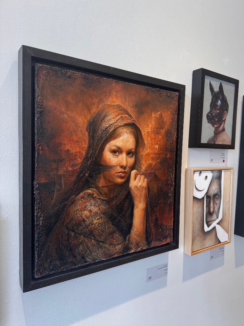 Art gallery with framed artworks on a wall