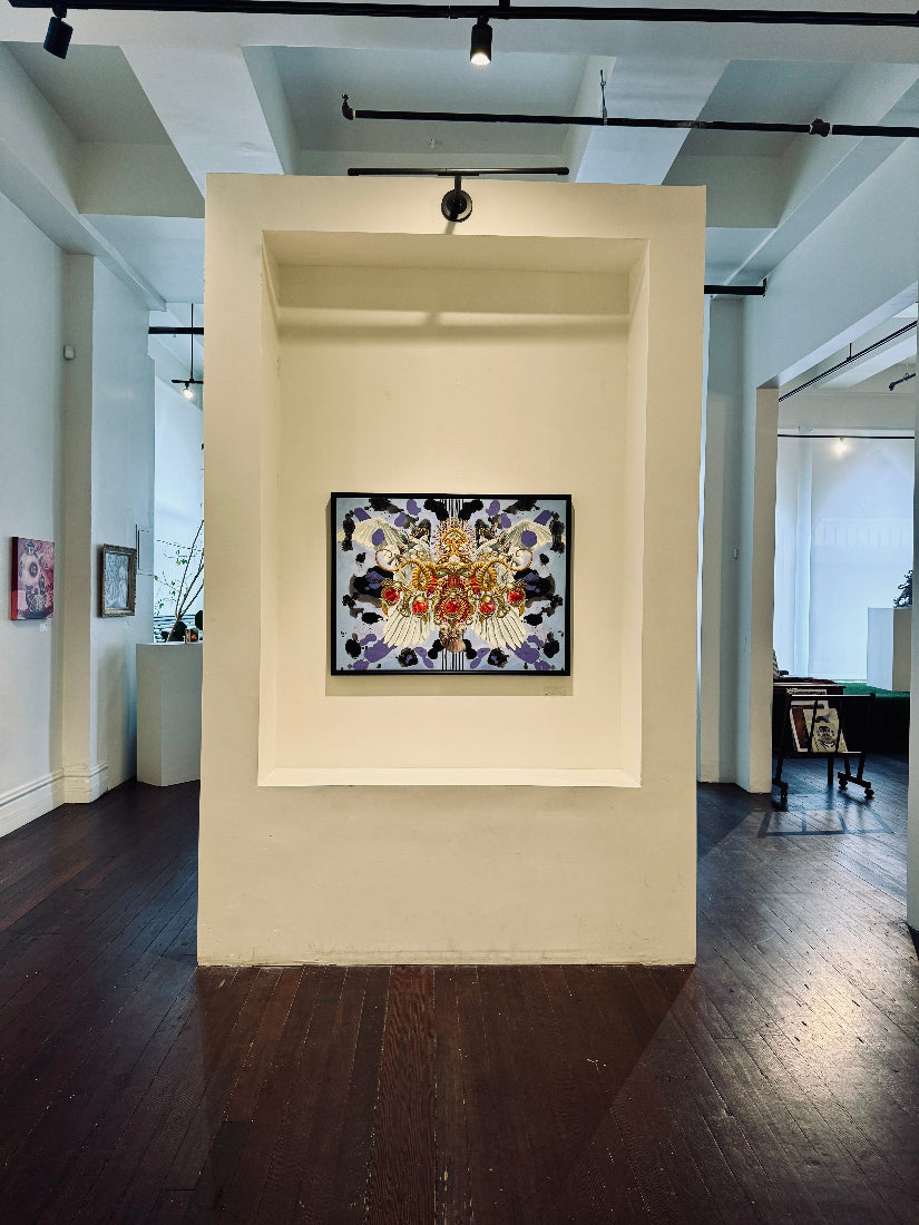 Decorative mosaic art piece on a wall in an art gallery setting