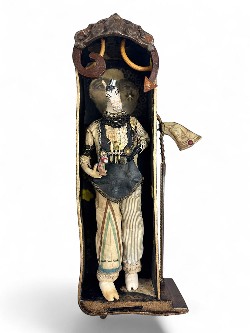 Decorative figure in a case with a white background