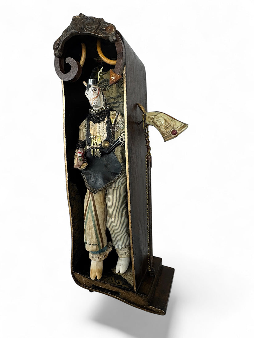 Detailed figurine of a character in a decorative case on a white background